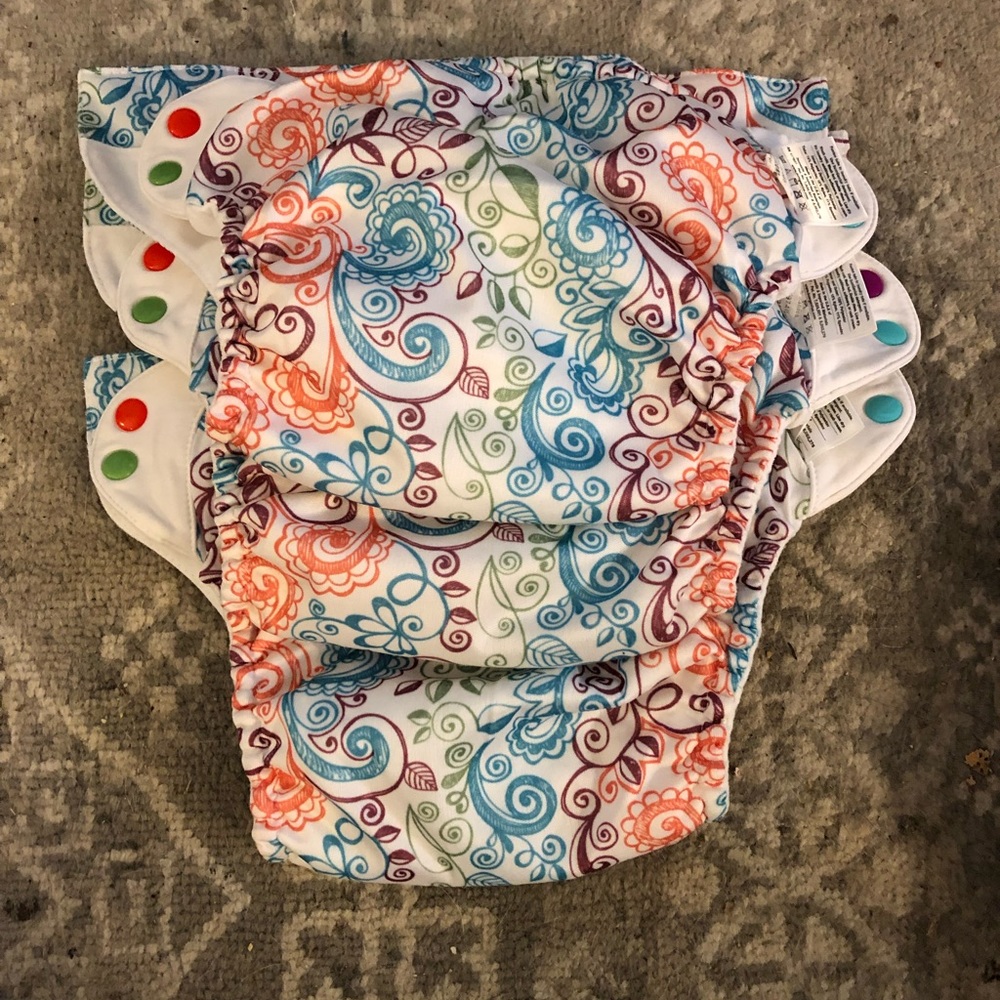 Set of 3 Bum Genius reusable cloth diapers and pads
